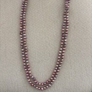 64" strand of mauve/lavender tone freshwater pearls
